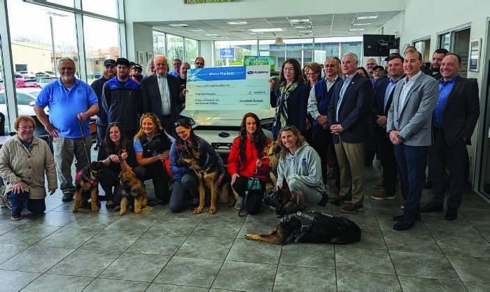 Suburban Subaru check presentation to Fidelco